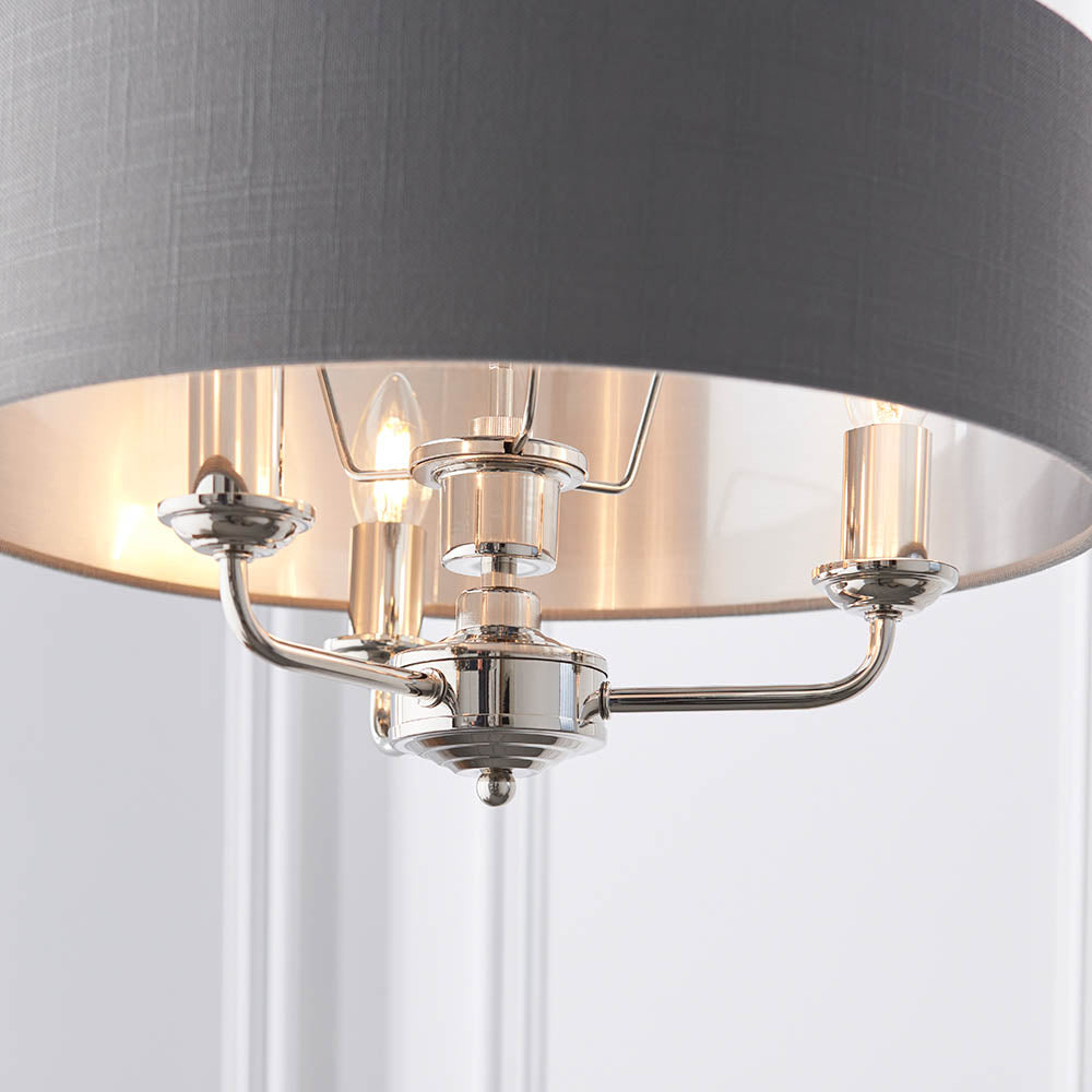 Close-up of Endon Brenley V1 3 light pendant showing nickel arms, E14 lamp holders and charcoal grey linen shade with brushed metallic inner lining.