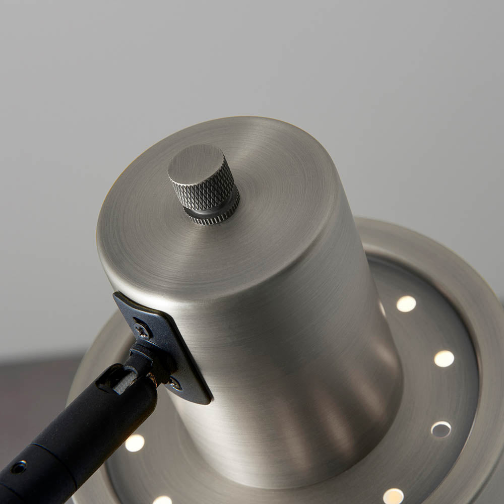 Close-up of the Endon Carlbourne floor lamp head in brushed silver with matt black bracket, showing knurled rotary switch and vent holes.