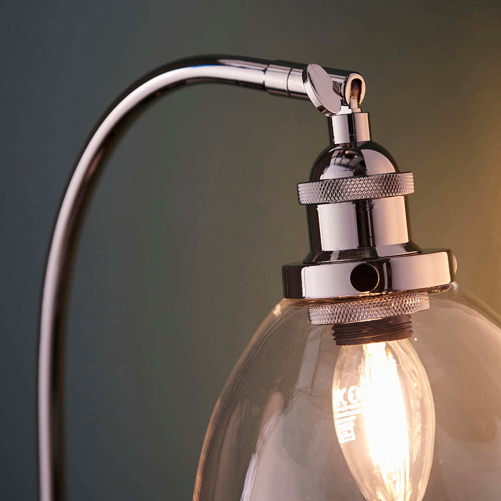 Close-up of Endon Wentworth table lamp showing nickel adjustable knuckle, knurled lamp holder, clear glass shade and visible filament E14 bulb.