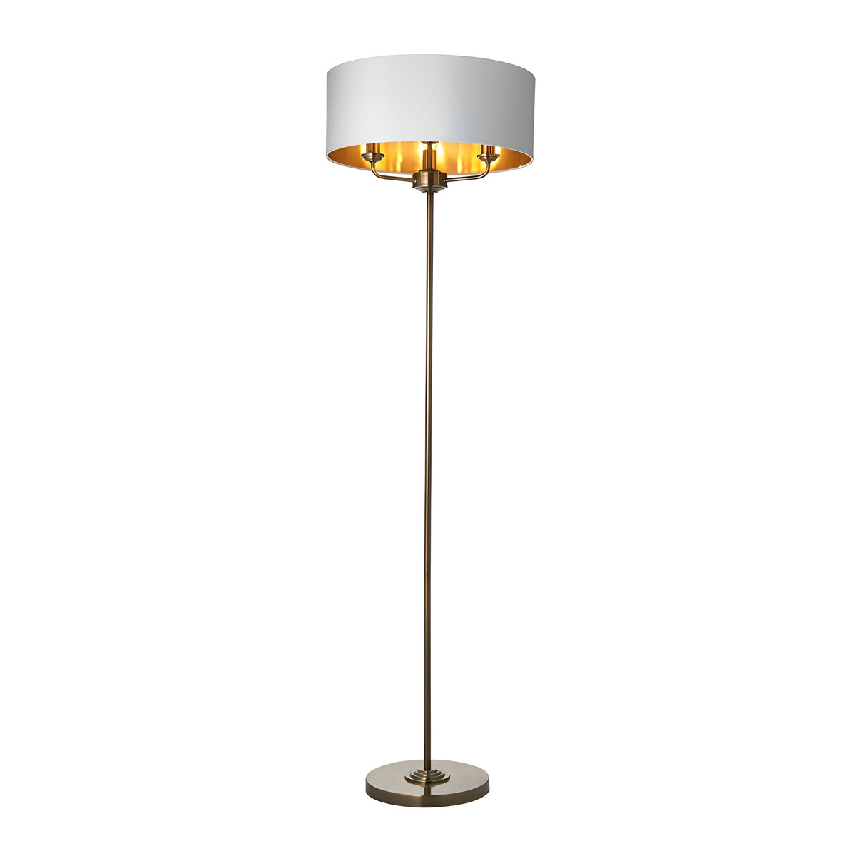 Endon Brenley 3 light floor lamp with wide white fabric shade, gold metallic inner lining and slim antique brass stem on a round base.