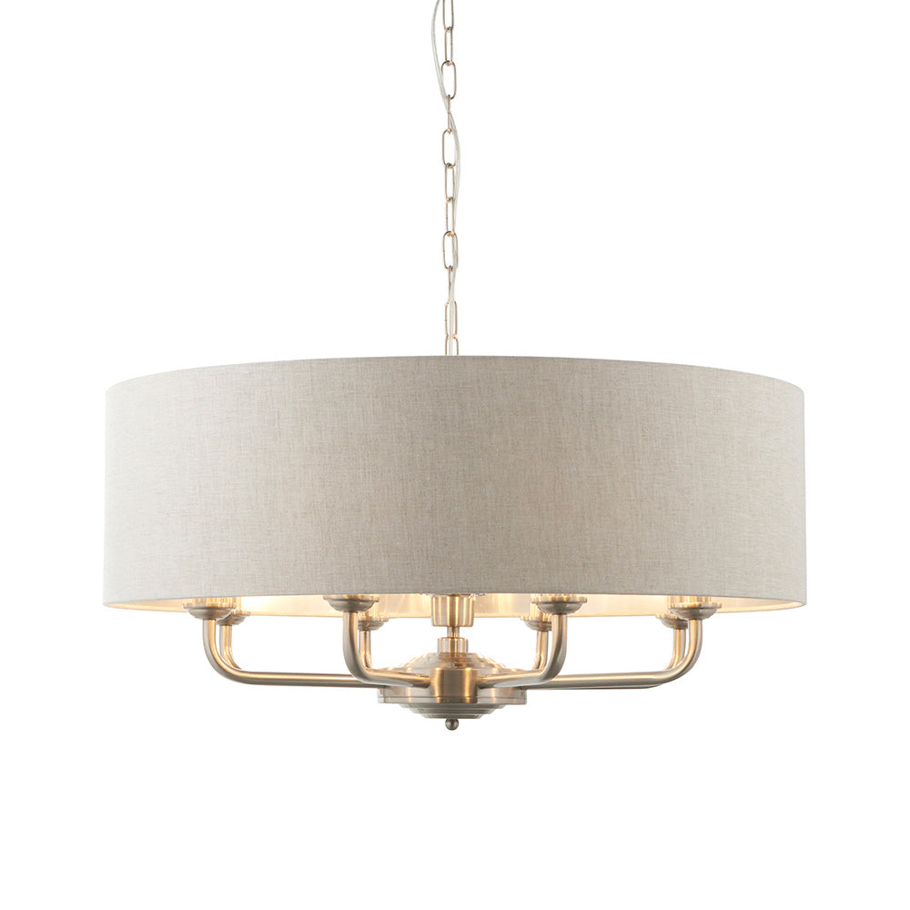 Endon Brenley 8 light pendant with natural linen drum shade and brushed chrome multi-arm frame on a chain suspension, shown on a white background.