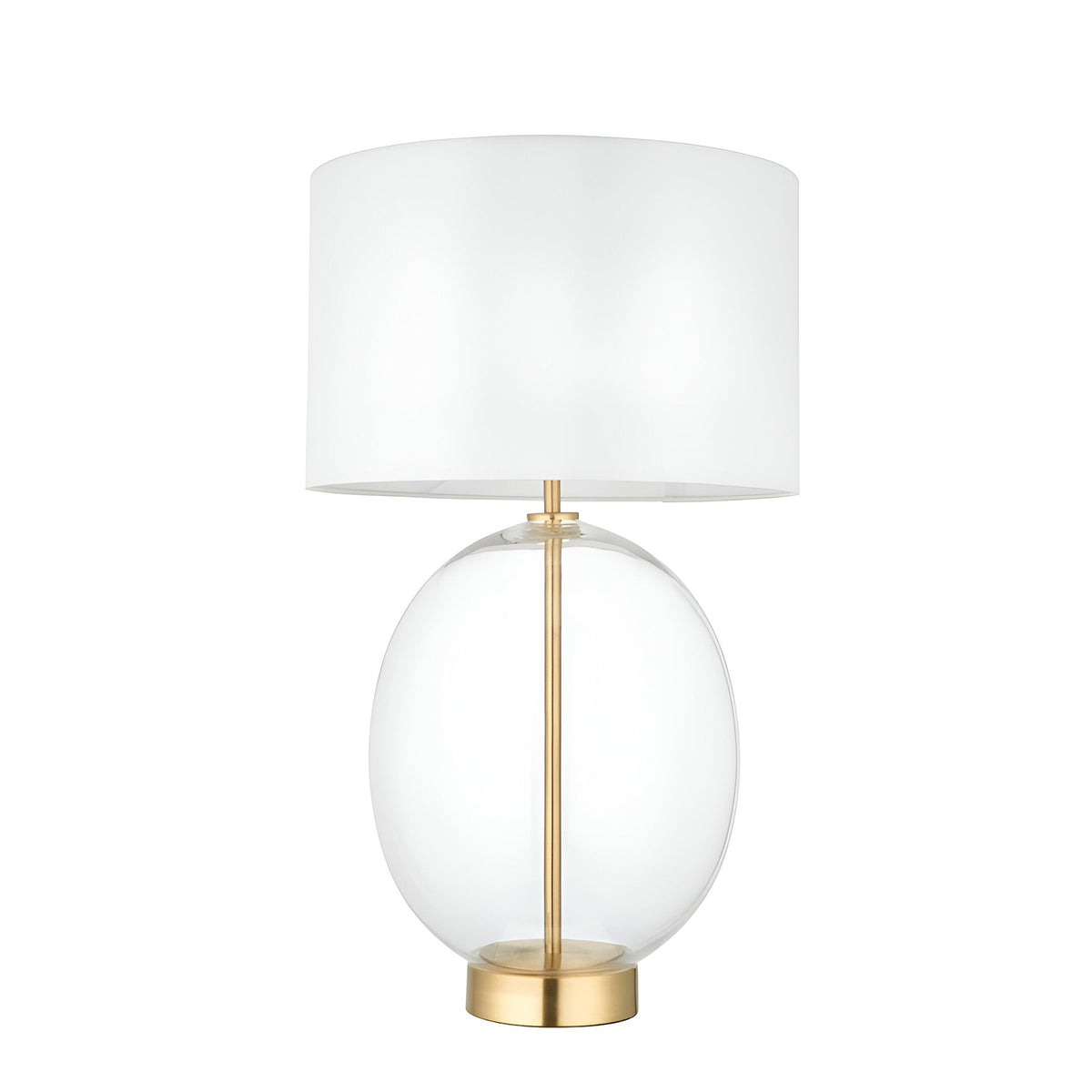 Brockmere Table Lamp with oversized oval clear glass base, satin brass stem and base plate, and white fabric drum shade on a plain white background.