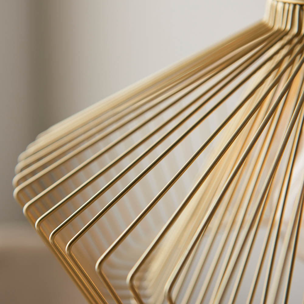 Close-up of the Endon Brockton cage pendant light showing its polished gold metal wires fanning out from the top in an open industrial silhouette.