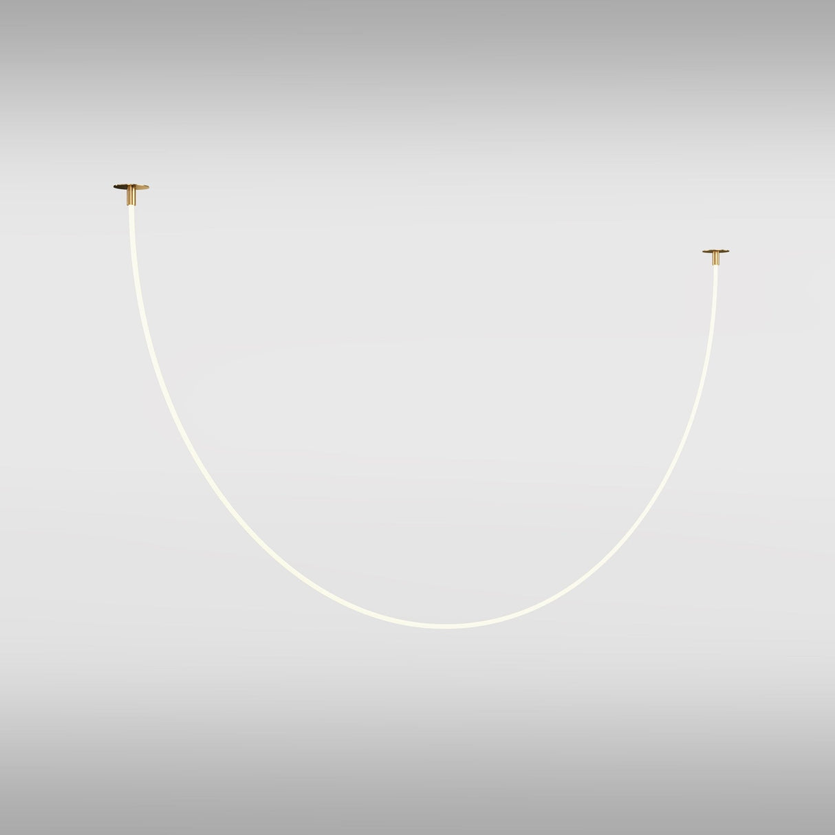 A minimalist white cord with a flexible silicon diffuser forms a U-shape between two gold wall mounts against a light gray background, highlighting modern decor. The simplicity of the Tau LED Pendant Light 40W - Gold creates a sleek and contemporary appearance.