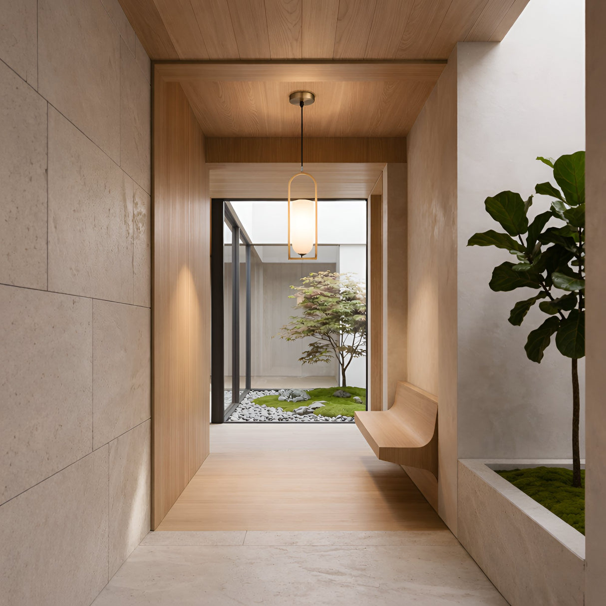 A modern hallway with light wood and stone accents features a built-in bench, a potted plant, and the Arvion 1 Light Slim Capsule Alabaster Pendant in brushed brass, overlooking a minimalist garden through a large glass window.