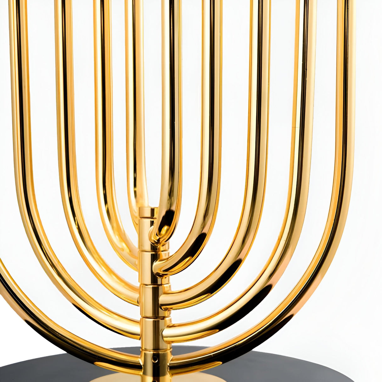 Close-up of the Ascot 4 Light Large Table Lamp in black and gold, its elegant curved design standing out on a black base against a white background—perfect as dramatic statement lighting with an Art Deco flair.