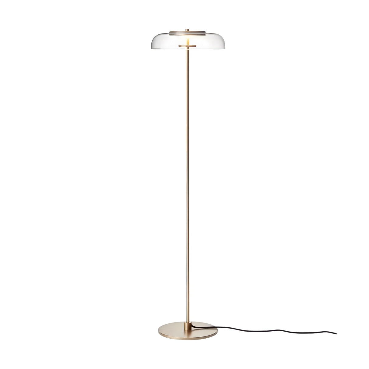 The Blossom LED Floor Lamp - Gold features a slim gold stand, round flat base, and clear glass dome-shaped shade. Its modern design is elegant and energy-efficient, with a black power cord extending from the base.