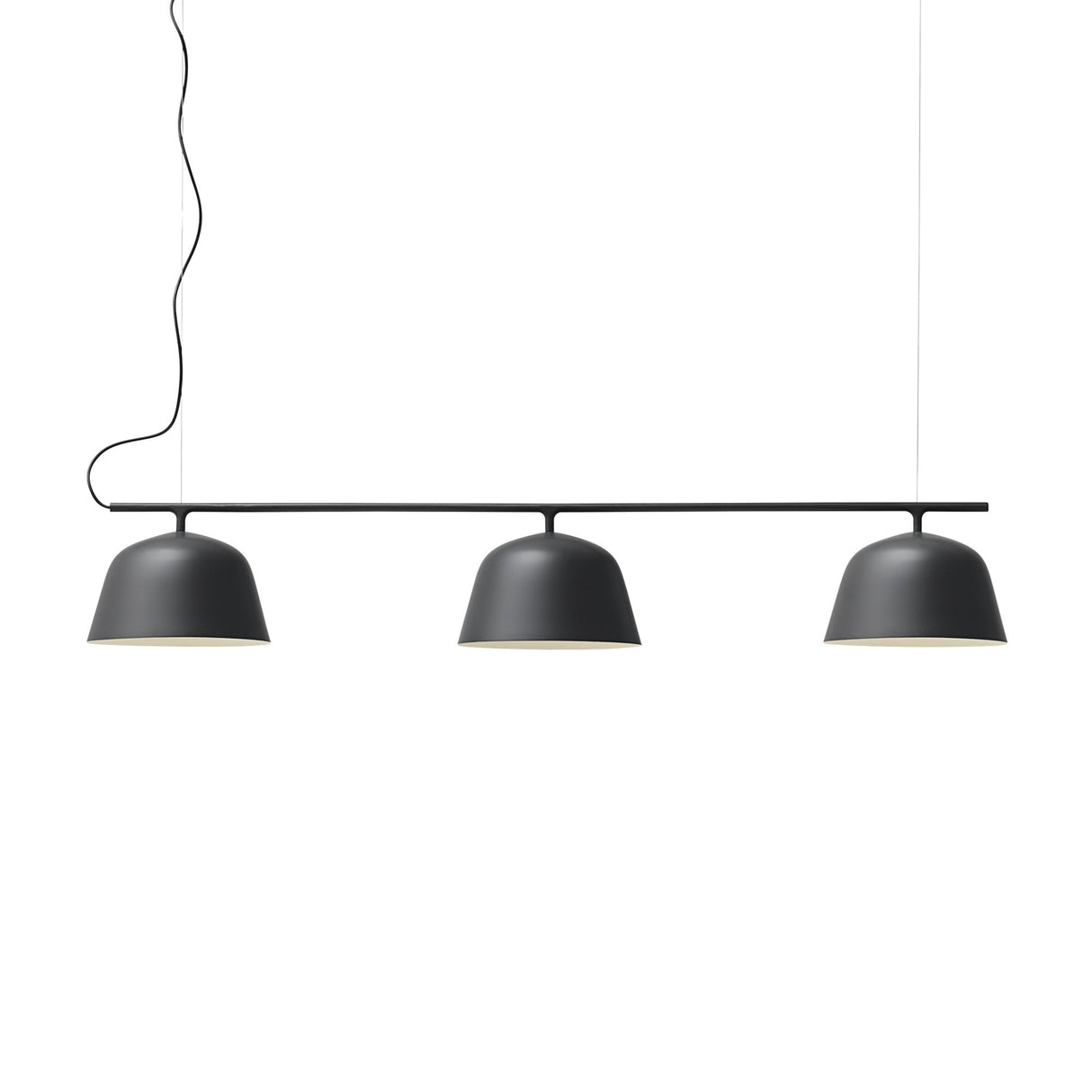 The Bounds 3 Light Linear Suspension Light features three matte black dome pendants hanging in a row from a horizontal rod, suspended by two slim cables and a black cord, all set against a white background.