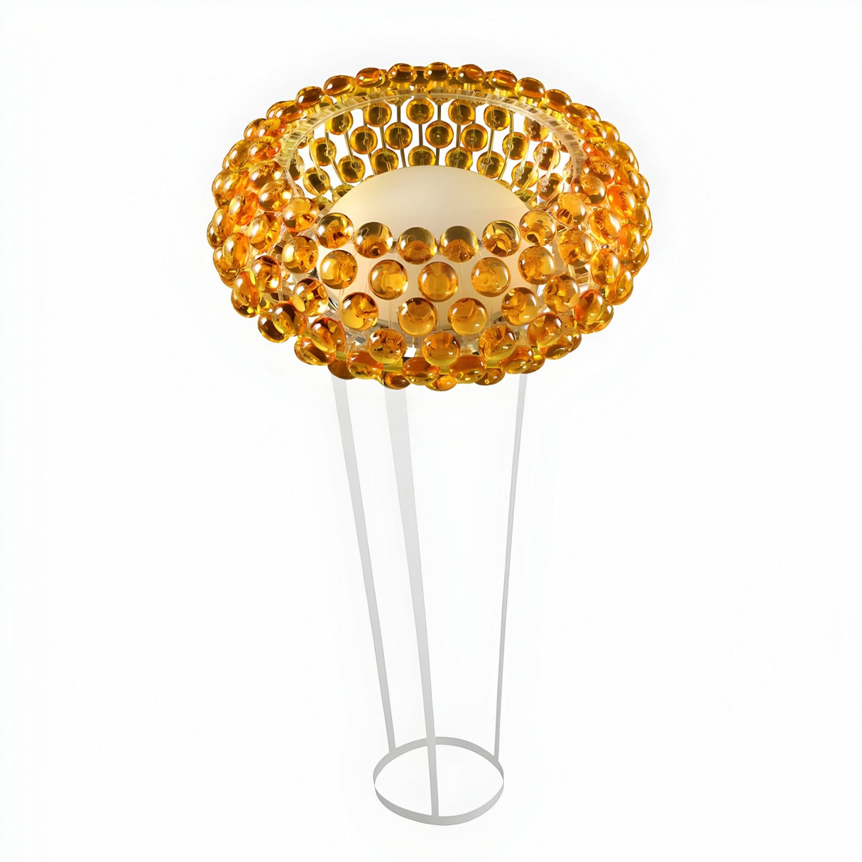 The Briller LED Floor Light - Gold features a circular shade of amber glass spheres and a sleek gold finish with three slender white legs on a round base, making it perfect for adding ambient lighting to any modern space.