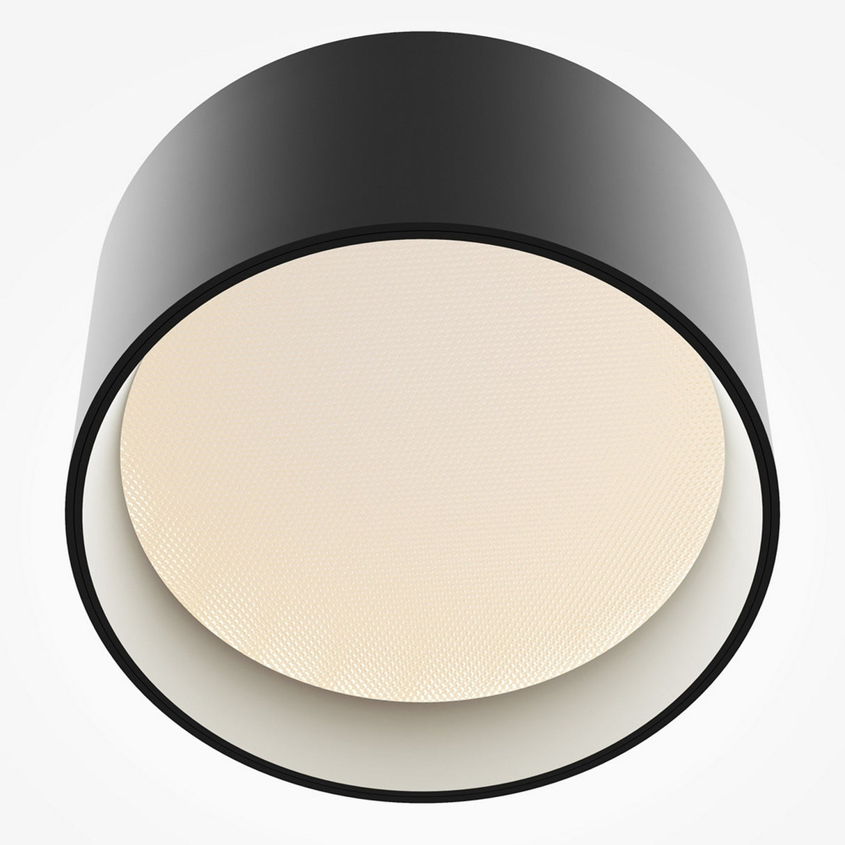 The Vega LED Round Surface Downlight 12W 3000K - Black is displayed against a white background, showcasing its modern black circular design with a textured off-white diffuser. This stylish fixture features an LED downlight for vibrant illumination, ideal for contemporary interiors.