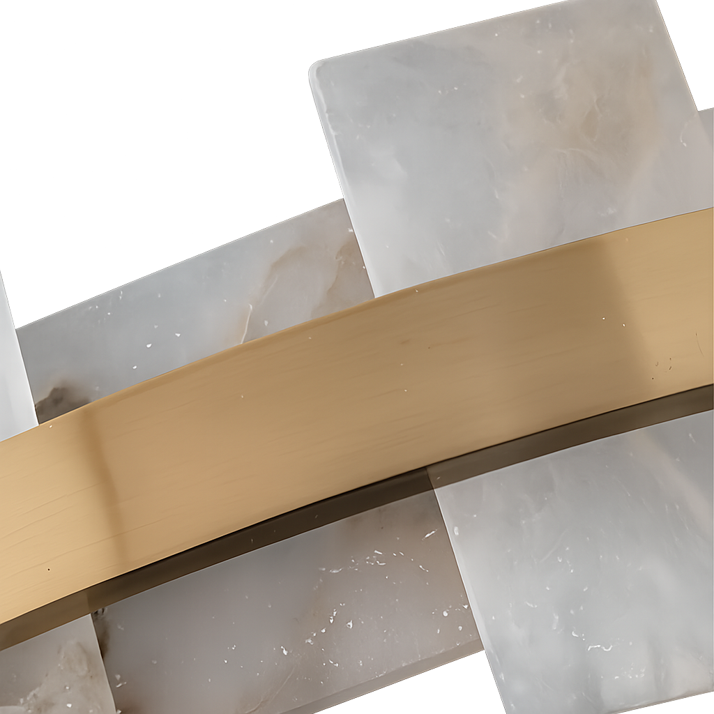Close-up of overlapping white and gray marble-like panels, echoing the Montyra LED Panelled Alabaster Linear Chandelier in Soft White & Brass, with a diagonal brushed brass strip, set against a white background.