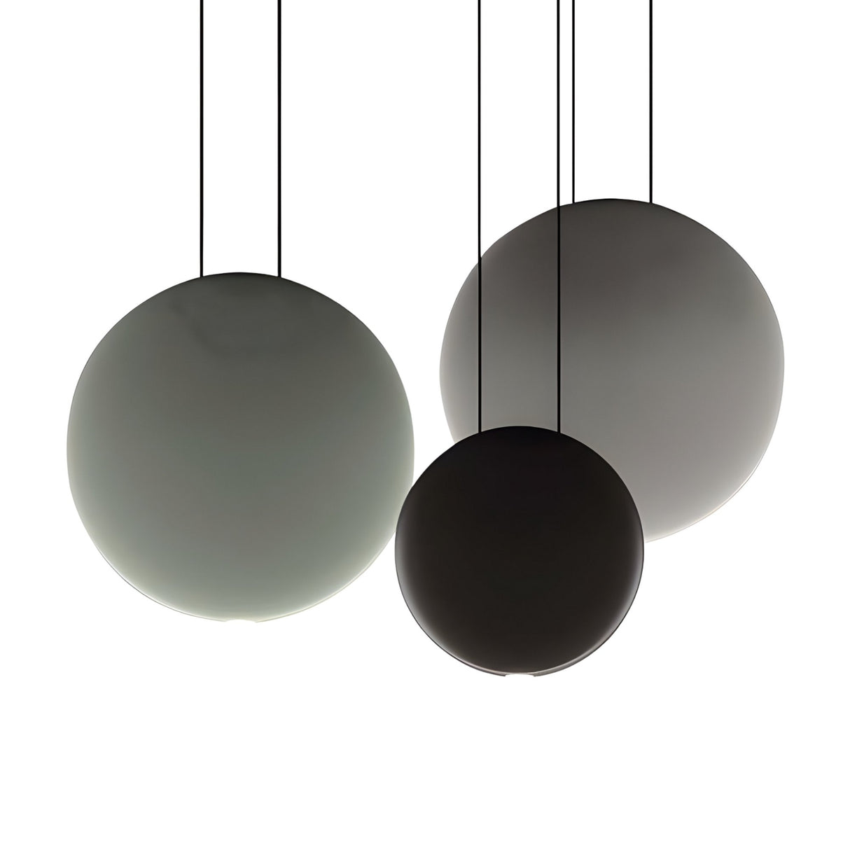 The Cosmos 3 Light LED Bar Pendant - V1 features three smooth, round pendant lights in gradient shades of grey and black, suspended from slim black cables for a minimalist look perfect for contemporary interiors.