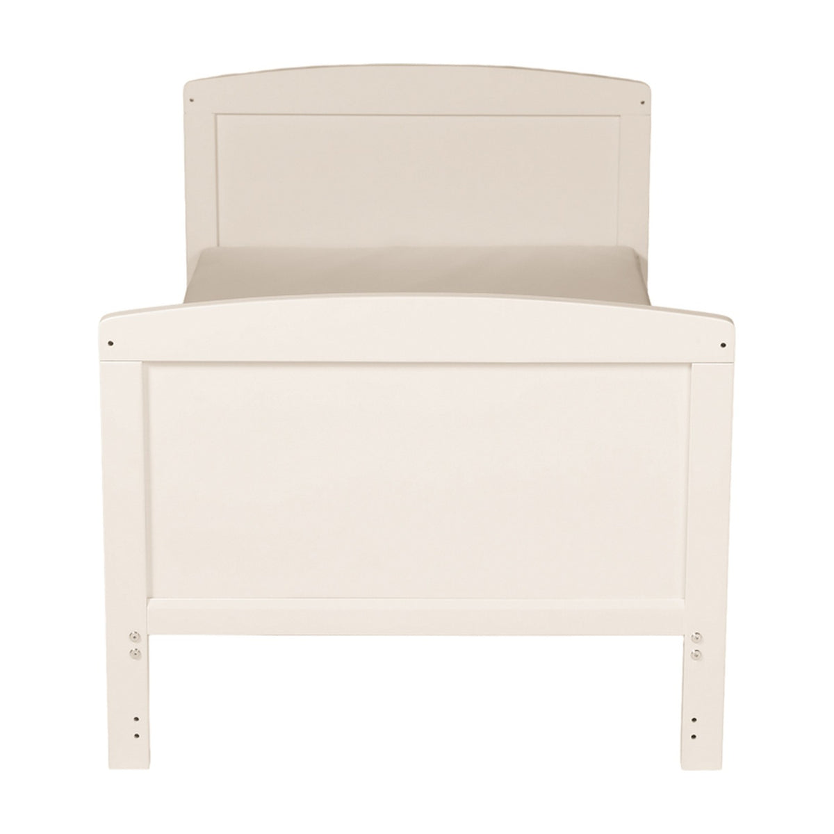 Dancer Convertible Cot Bed shown as a toddler bed in cashmere cream finish, with panelled headboard and footboard, scalloped edge, and visible mattress on a plain background.