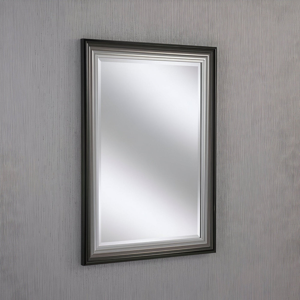 With its black and silver frame, the Deco Rectangle Wall Mirror - Black/Silver reflects light beautifully and adds a modern edge to any textured gray wall.