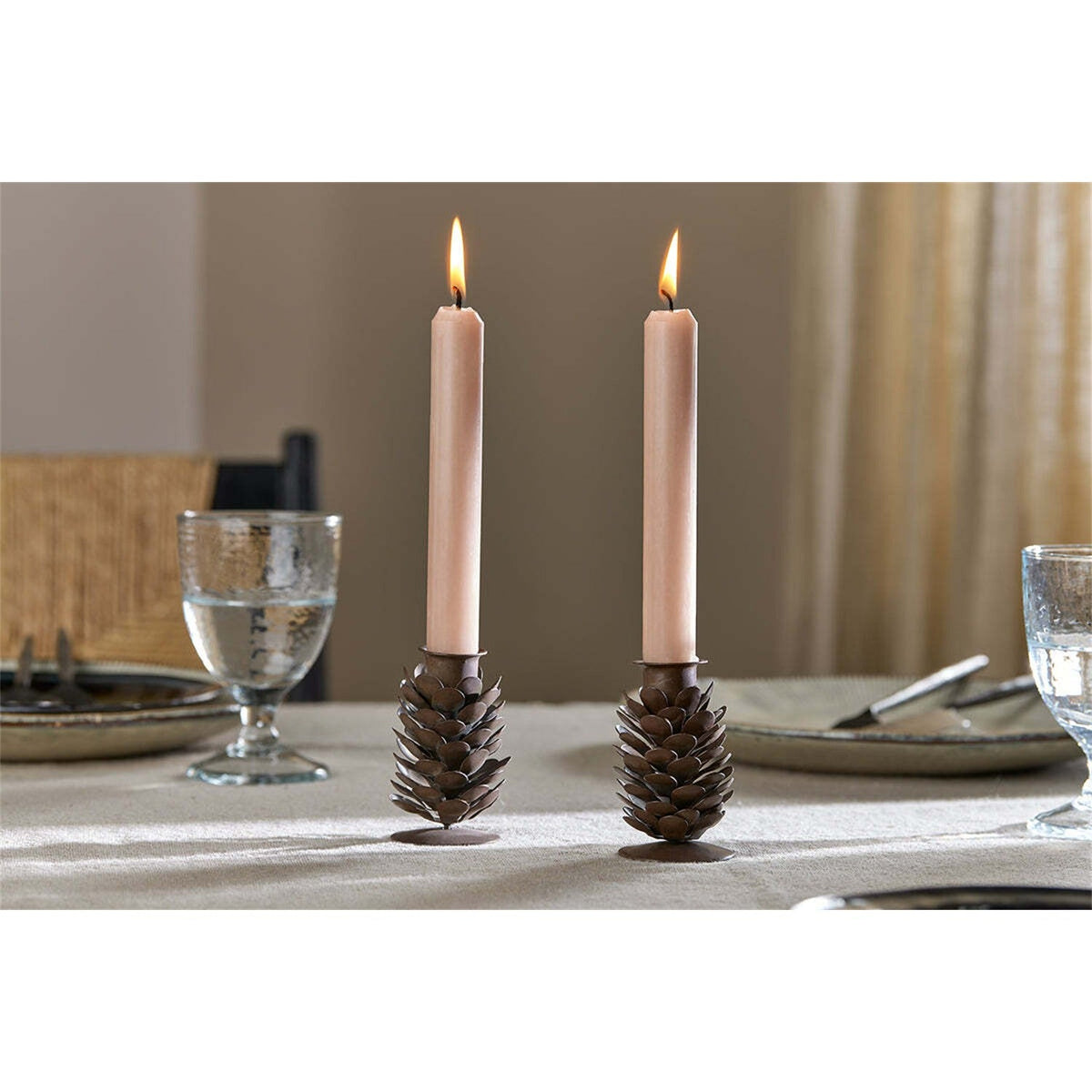 Elagalu Pine Cone Candle Stick - Rust - Set of 2 in a dining room
