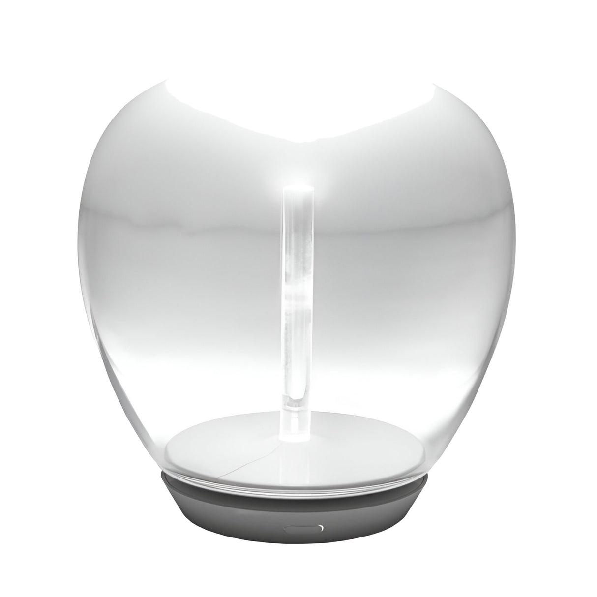 The Empatia LED Table Lamp – Clear features modern, hand-blown translucent glass with a rounded design, a vertical LED light source, and a flat circular gray base, emitting a soft white glow using energy-efficient technology.