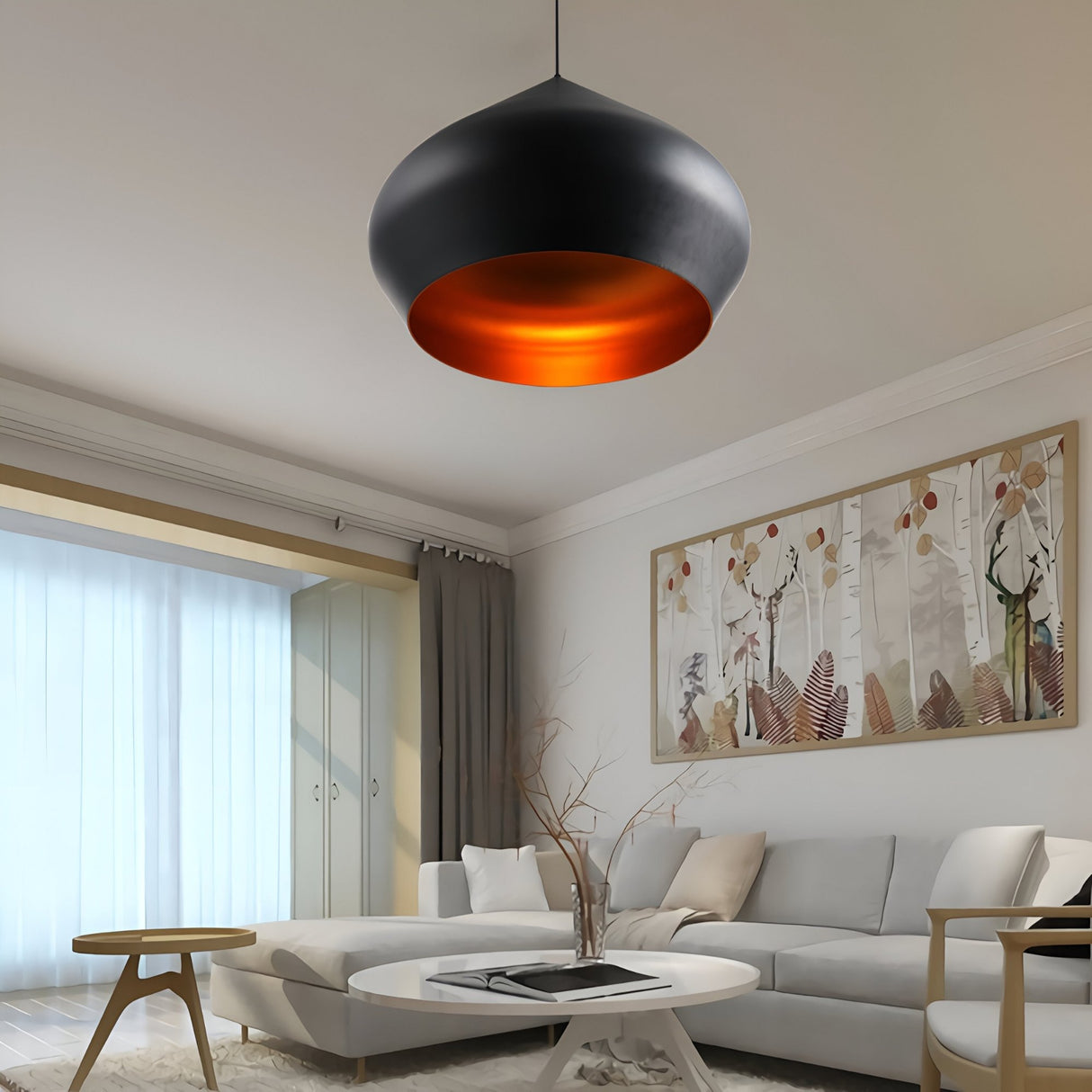 A modern living room with a white sofa, round coffee table, abstract wall art, sheer curtains, and a touch of sophistication from the Funk Stout Small Pendant Light – Black with an orange interior hanging overhead.