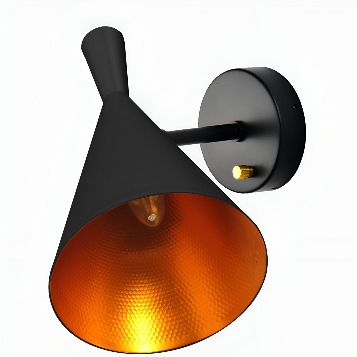 The Funk Wall Light - Black features a matte black conical shade with a gold textured interior, set on a black circular base accented by a gold knob. The exposed bulb inside emits an inviting ambient glow.