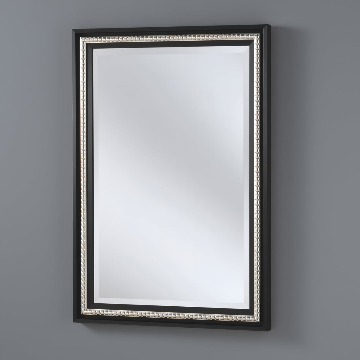 Rectangular wall mirror framed with a textured dark grey border, placed against a patterned wallpaper, blending a modern industrial design with subtle elegance.