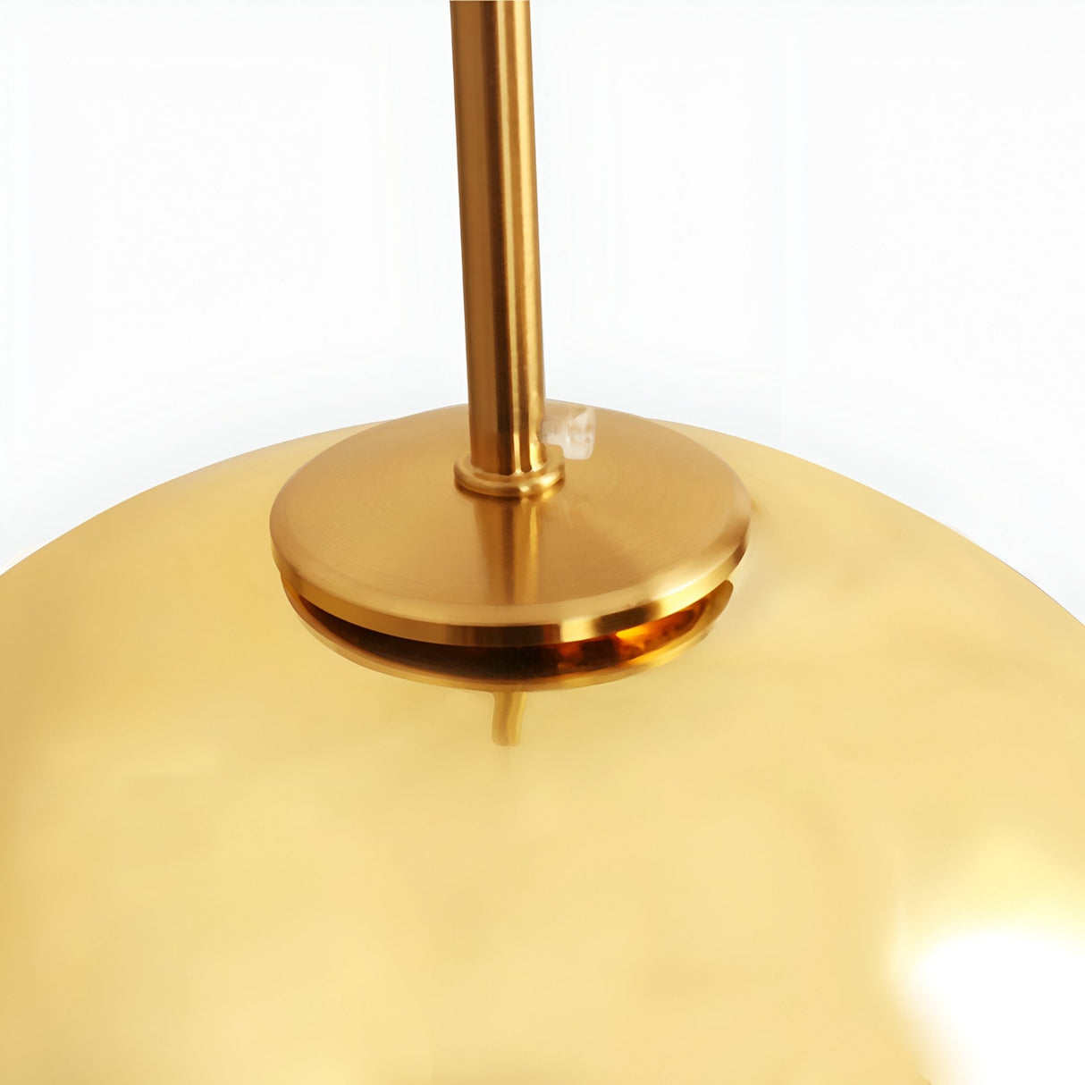 Close-up of the Grand Ball Glass Pendant 25cm in Gold, featuring a modern LED design with a reflective gold surface and central rod—ideal for adding luxurious lighting to any space.