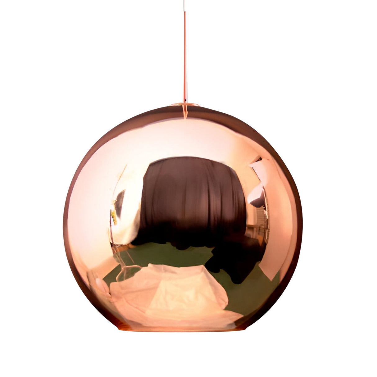 The Grand Ball Glass Pendant 40cm - Copper features a shiny, spherical glass shade with a sleek copper finish. It hangs from a slim cord and reflects its surroundings on a smooth surface against a white background.
