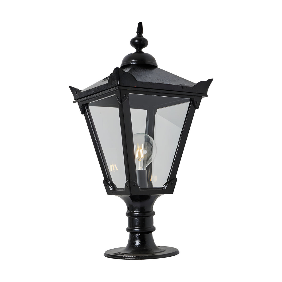 Victorian Manor cast iron pillar light in black, tapered lantern with clear glass panels, ornate finial top and pedestal base, single E27 bulb visible, plain background.