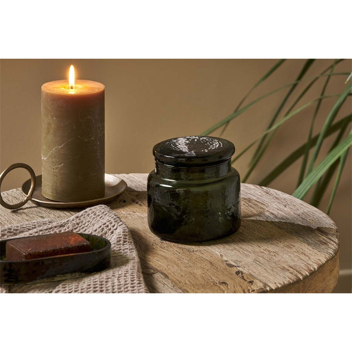 Ilcoso Recycled Hammered Glass Storage Pot - Green in a bathroom