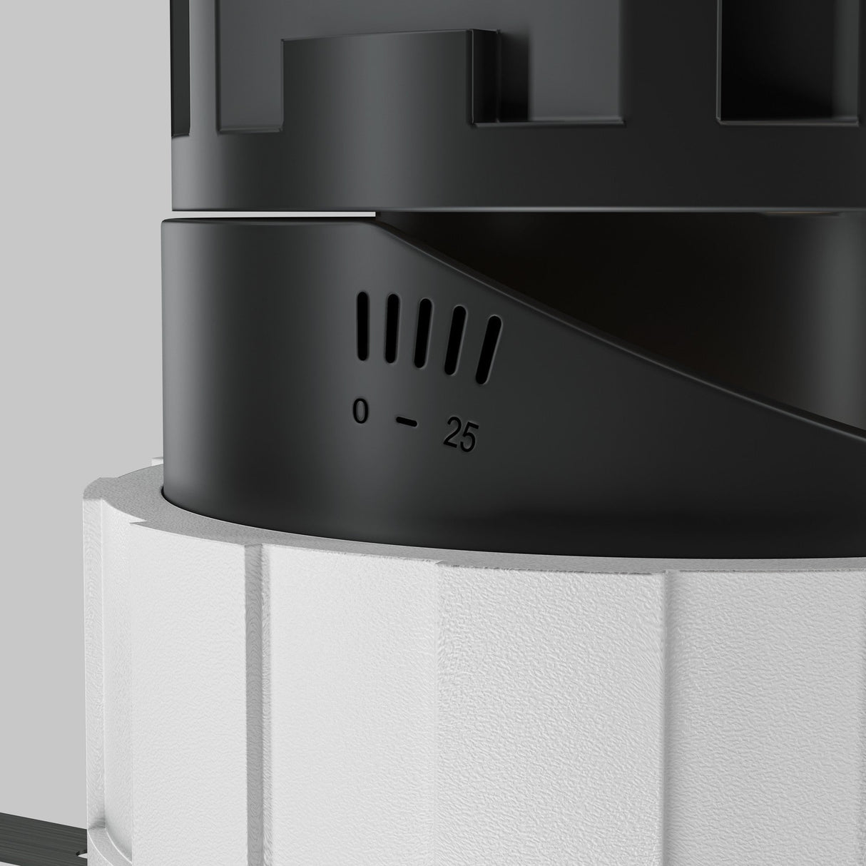 Close-up of a Wise LED Round Recessed Downlight 10W 3000K in white, resembling a black and white cylinder with a dial numbered 0 to 25, featuring a sleek modern design with a textured white base and smooth black top, possibly offering CRI 90 for enhanced color accuracy.