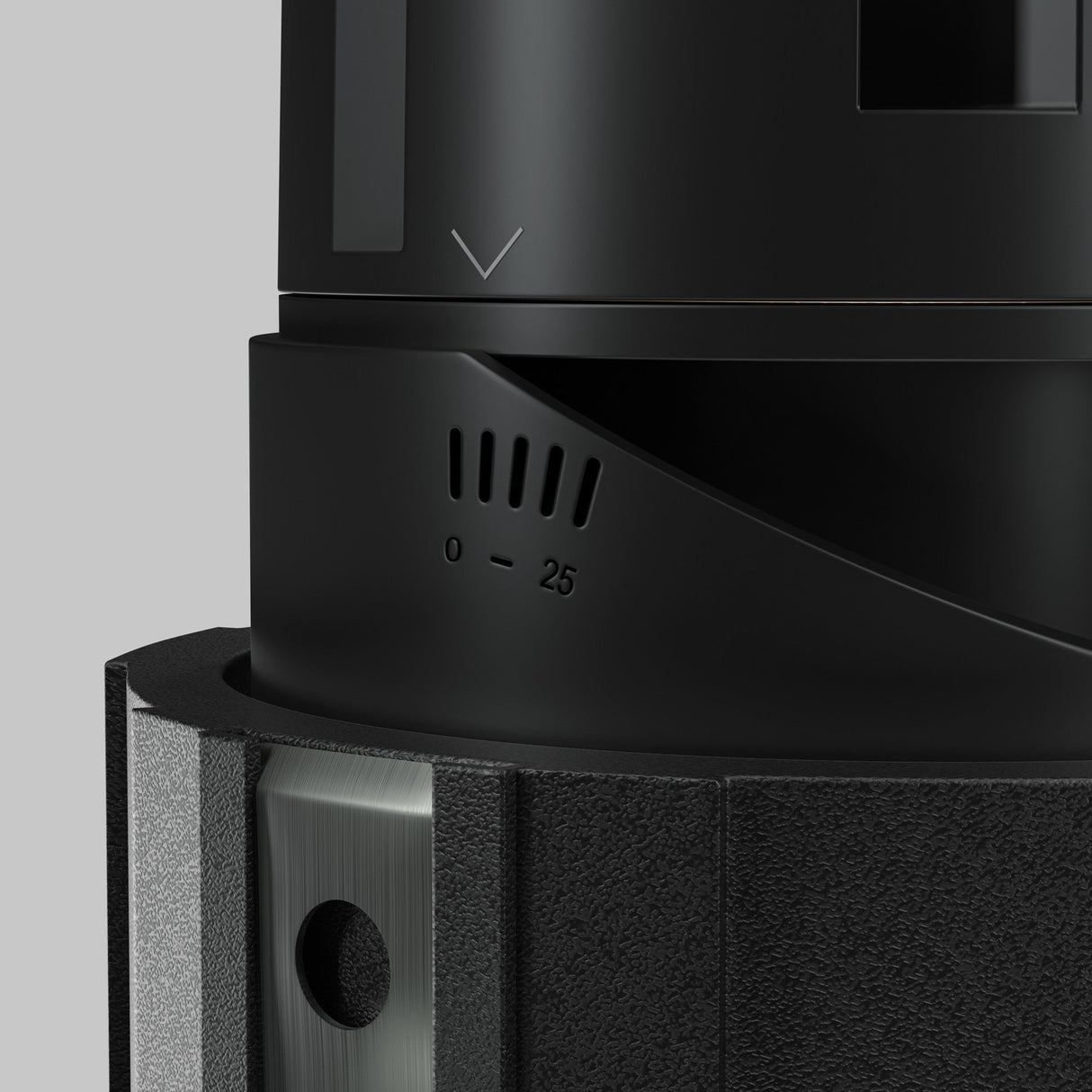 Close-up of a black Wise LED Round Recessed Downlight 7W 3000K, featuring a numbered dial (0-25), textured surface, and metallic accents. A downward arrow is above the dial on a plain gray background.