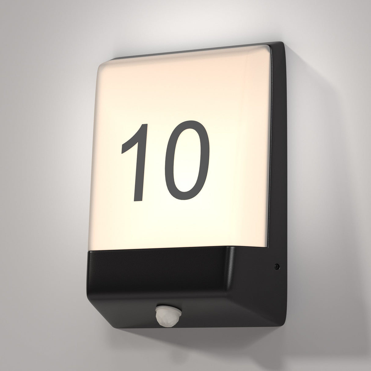 The Row LED Outdoor Wall Light (9W 3000K - Graphite) showcases a bold black 10 on frosted white, features IP44 protection, and includes a small white sensor at the bottom center. Its elegantly mounted on a light gray wall.