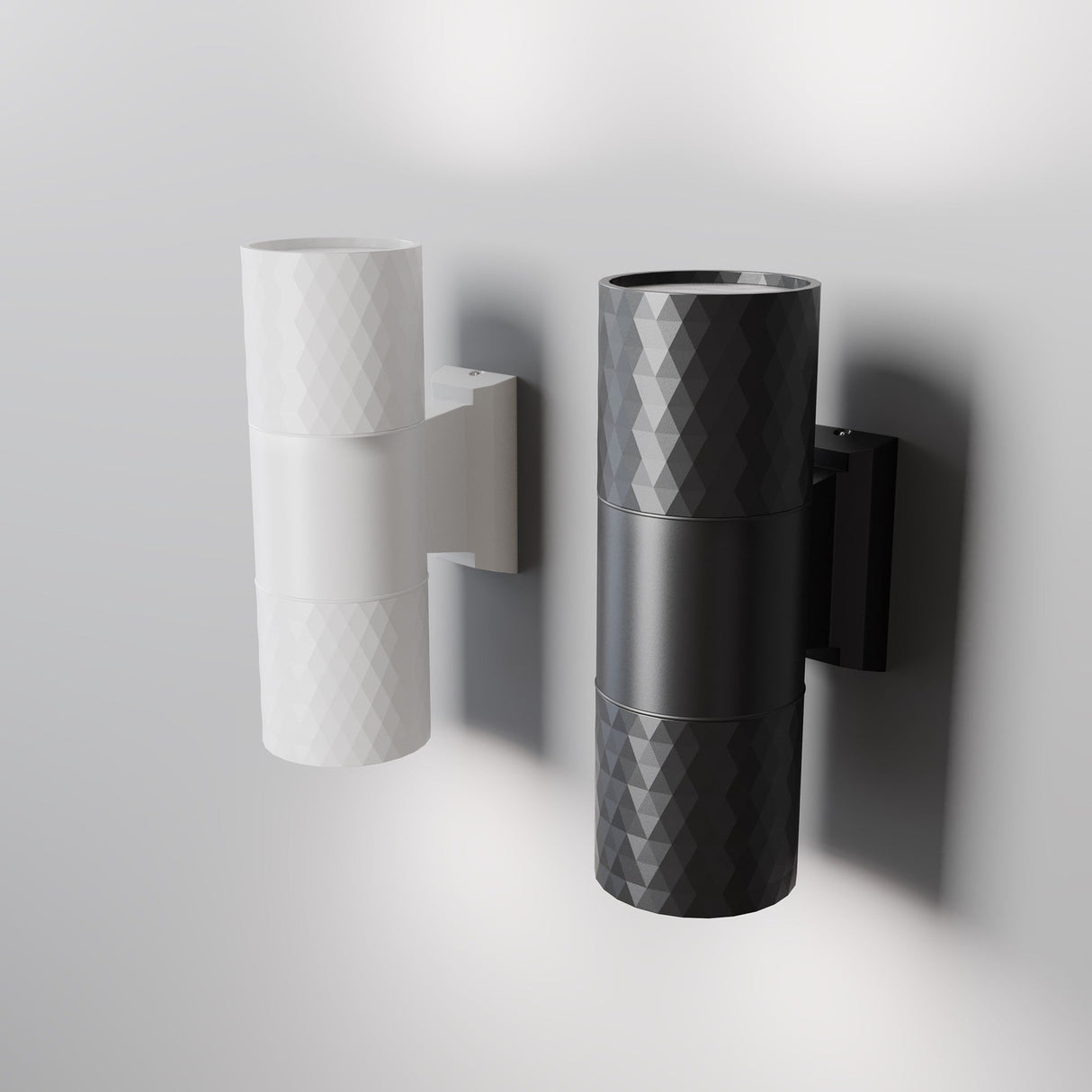 The Bowery Outdoor 2 Light Wall Light in white (O583WL-02W) is a modern, wall-mounted fixture with a geometric pattern. This elegant outdoor light emits illumination from both ends, casting a glow on the wall and providing stylish, corrosion-resistant lighting for any space.