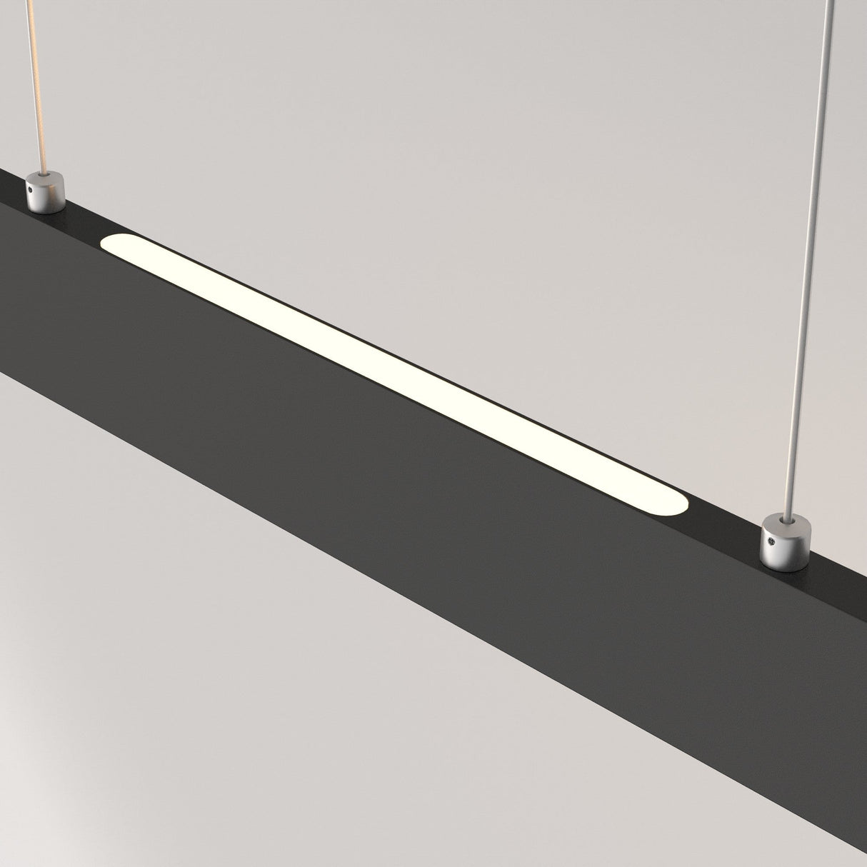 A close-up shows the Step LED Linear Suspension Light 3000K 23W in black, hanging from a light-colored ceiling. The sleek fixture features a long, narrow illuminated strip using SMD LED technology and is suspended by two thin cables.