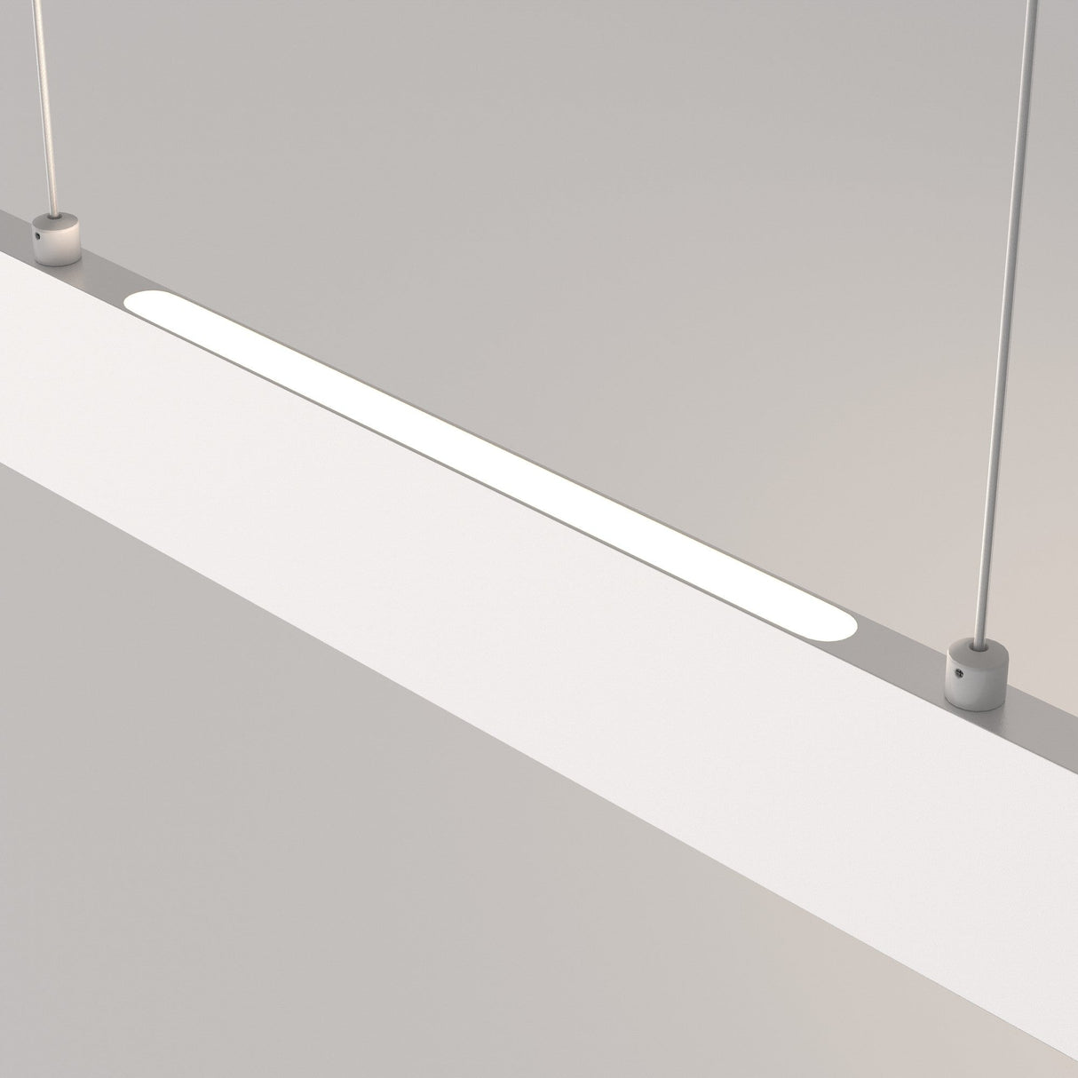 The Step LED Linear Suspension Light 4000K 23W in white showcases a minimalist rectangular design suspended by two thin cables against a grey backdrop, emitting an energy-efficient soft white glow.