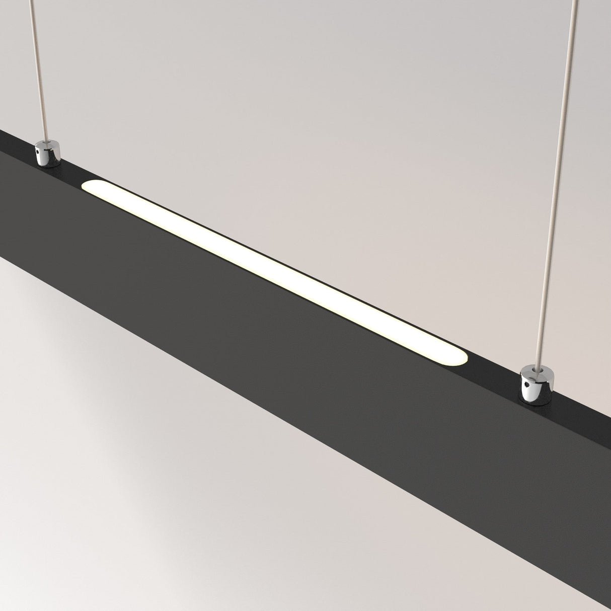 The Step LED Long Linear Suspension Light 3000K 30W in black features a minimalist design with a sleek housing and SMD LED technology. Its mounted horizontally with silver brackets and wires against a neutral background, ensuring optimal performance and style.