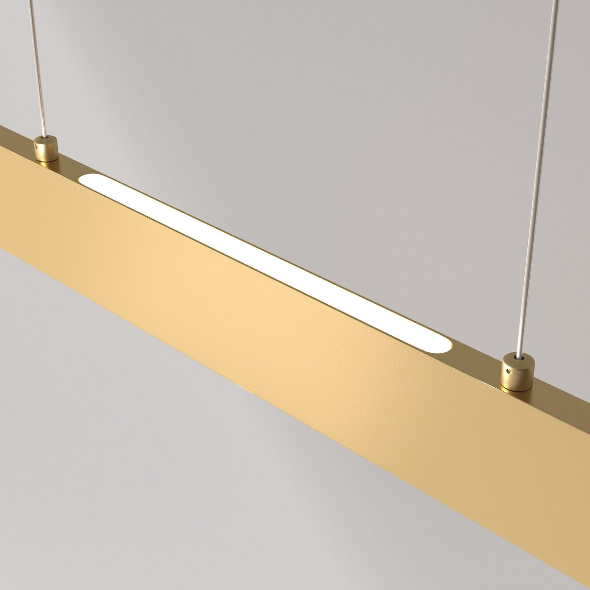 The Step LED Long Linear Suspension Light 4000K 30W - Gold features a minimalist design with SMD LEDs, hanging from two thin cables against a neutral backdrop. Its sleek rectangular form emits a soft white glow.