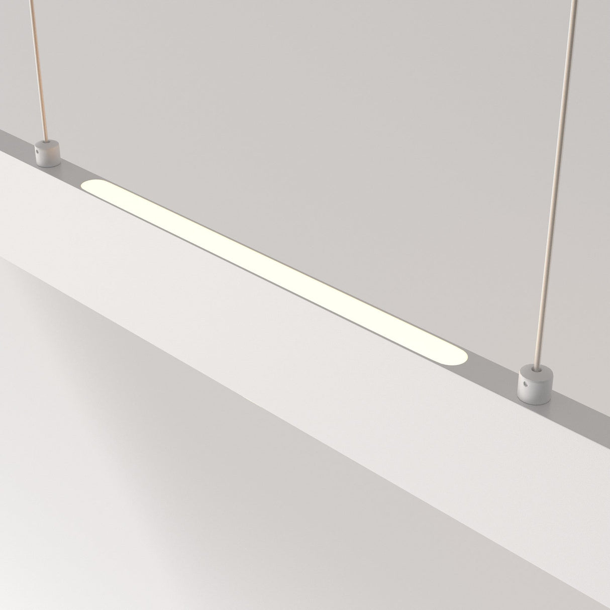 The Step LED Long Linear Suspension Light 3000K 30W - White features SMD LED technology and a minimalist, slim design, suspended by two cables. It emits a soft, warm glow on a plain white background, enhancing its modern elegance.