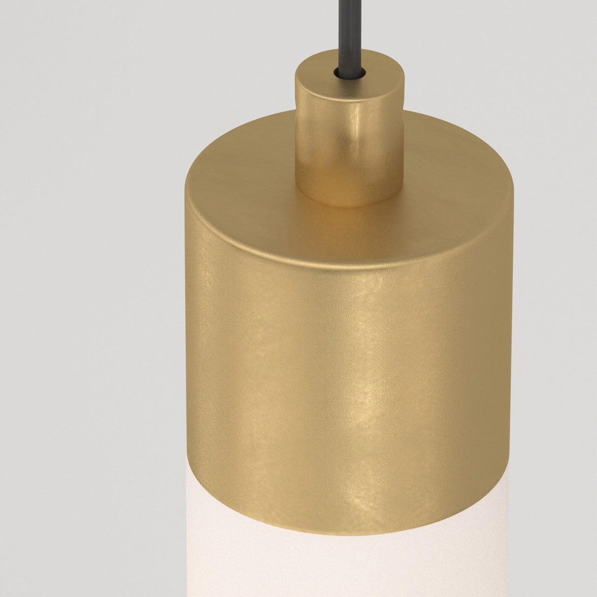 Close-up of the Ray LED Long Pendant Light in matte gold and white, showcasing its sleek cylindrical design. Its suspended by a black cable, adding elegance against the plain gray backdrop.