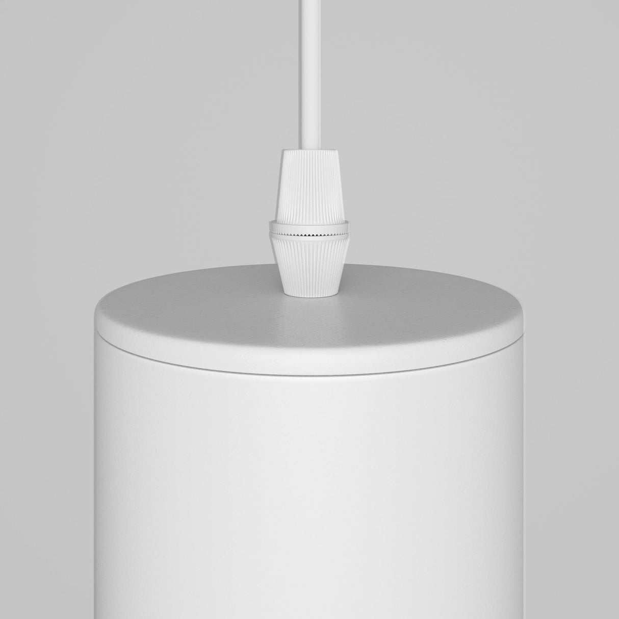 The Focus Single Pendant Light - White features a sleek, white cylindrical design that hangs elegantly from a matching cord against a light gray background, ideal for contemporary interiors and enhancing its minimalist charm.