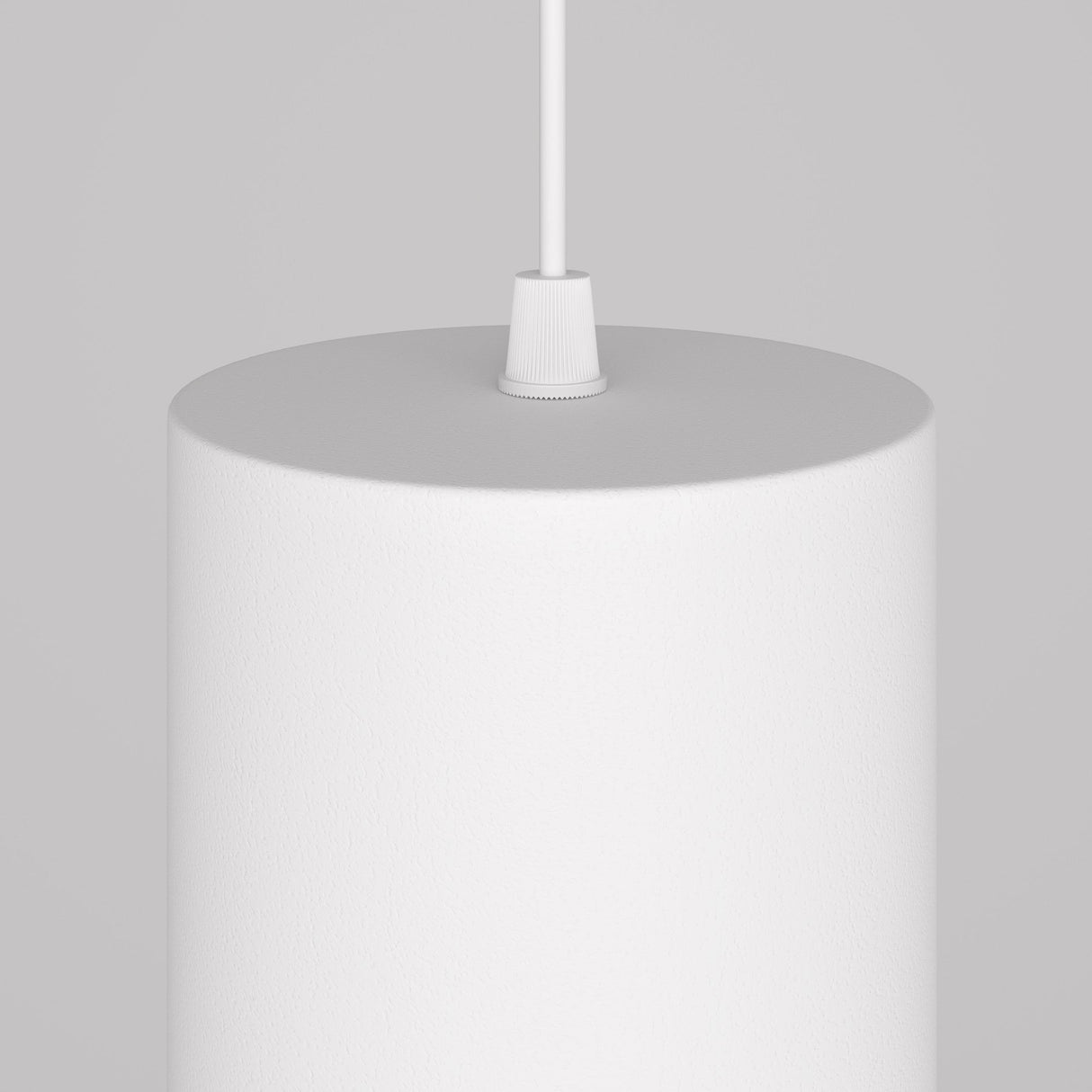 The Orlo LED Pendant Light 4000K - White is a close-up view showing its textured cylindrical design, hanging by a thin white cord. Ideal for modern spaces, it features an adjustable suspension against a neutral gray backdrop.