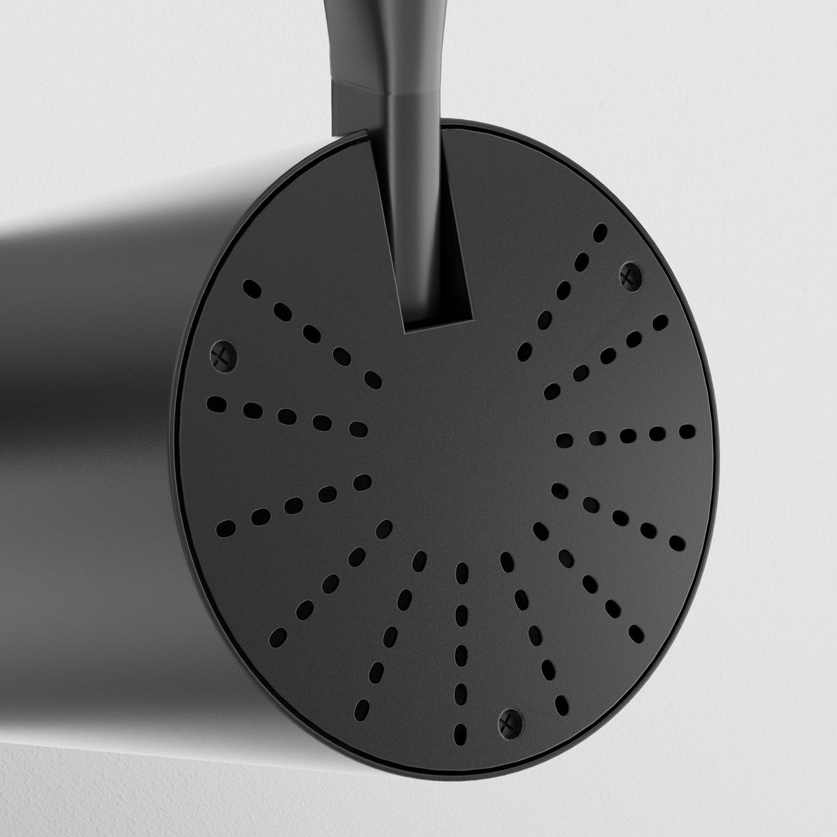 Close-up of a black watering can’s spout on a white backdrop, resembling the precision of Vuoro S LED Single Phase Unity Track Spotlight 15W 3000K. The round, perforated nozzle is visible, designed for even water distribution.