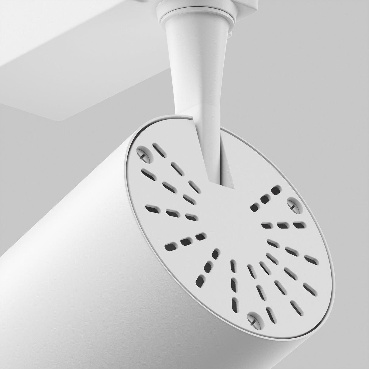 Close-up of the Vuoro S LED 6W spotlight in white, showcasing its cylindrical design with a perforated front panel and adjustable swivel mechanism, attached to an angled support against a light gray background for a sleek, minimalist aesthetic.