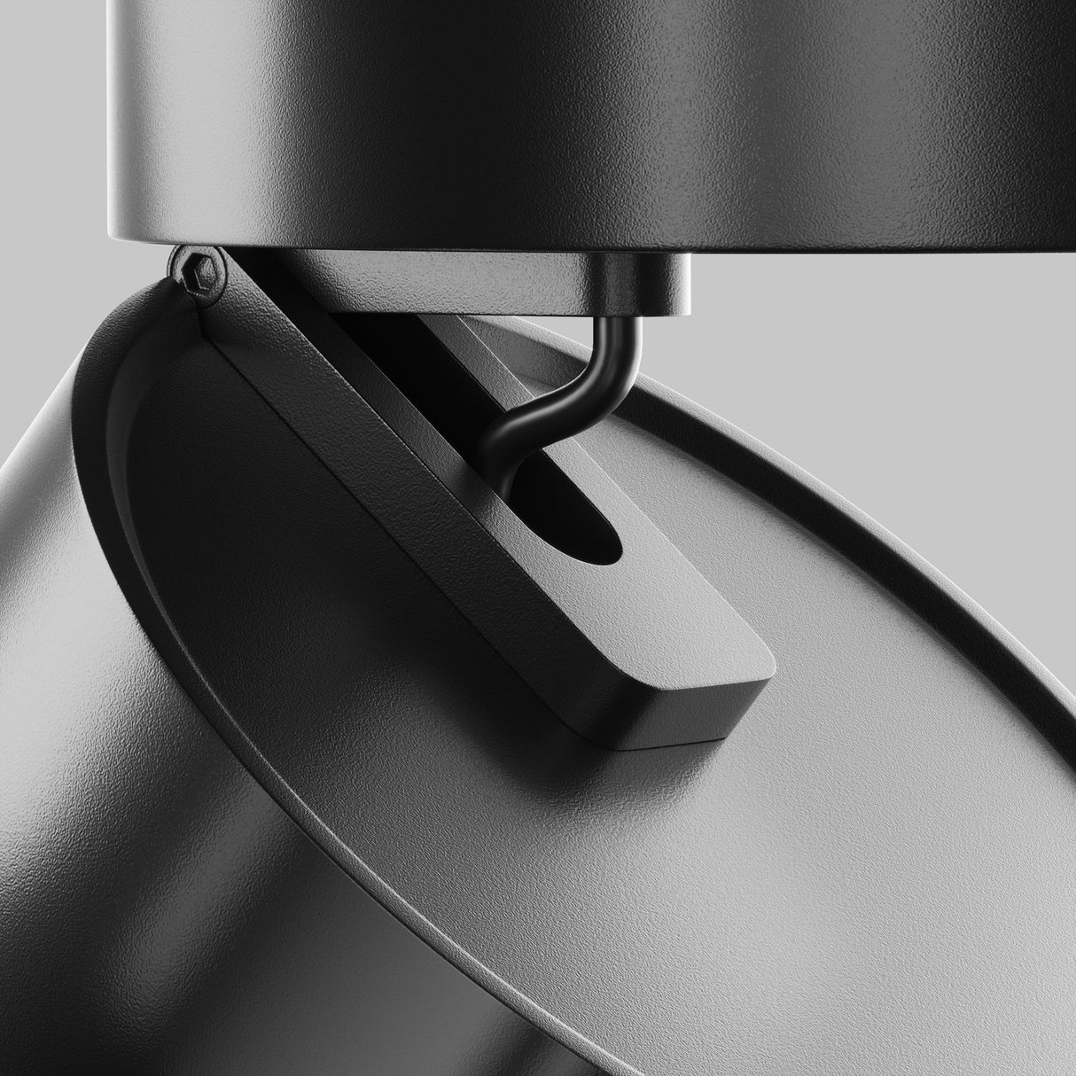 Close-up of the Onda LED Single Phase Unity Track Spotlight 18W 4000K - Black, featuring a smooth matte finish and mounted on a light gray background. The image emphasizes its pivot mechanism, demonstrating its sleek contribution to contemporary lighting design.