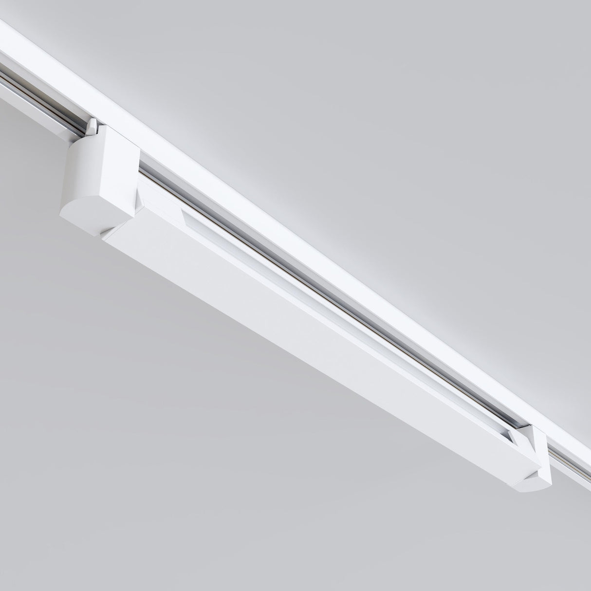 The Points Rot LED Swivel Linear Track Light for Single Phase Track Unity is a modern, rectangular fixture that mounts on the ceiling rail. Its sleek recessed design provides a minimalistic appearance, blending seamlessly with the ceiling while emitting warm white light at 3000K in a horizontal alignment.