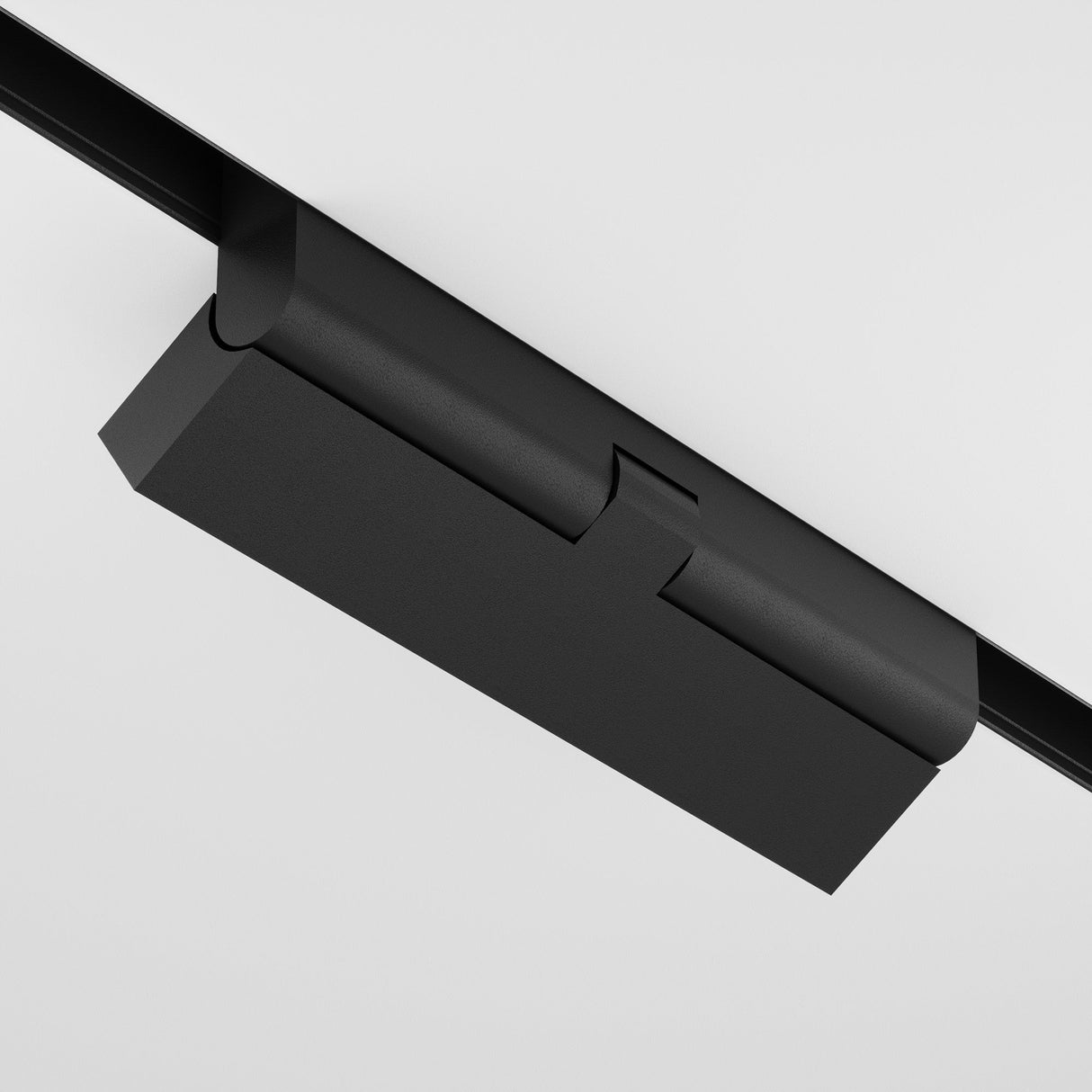Close-up of the Points Rot DALI CCT LED Dimmable Adjustable Linear Track Light for Magnetic Exility, a sleek black rectangular light mounted on a track against a plain white ceiling. This minimalist 12W design complements contemporary spaces with adjustable 2700-6000K lighting.