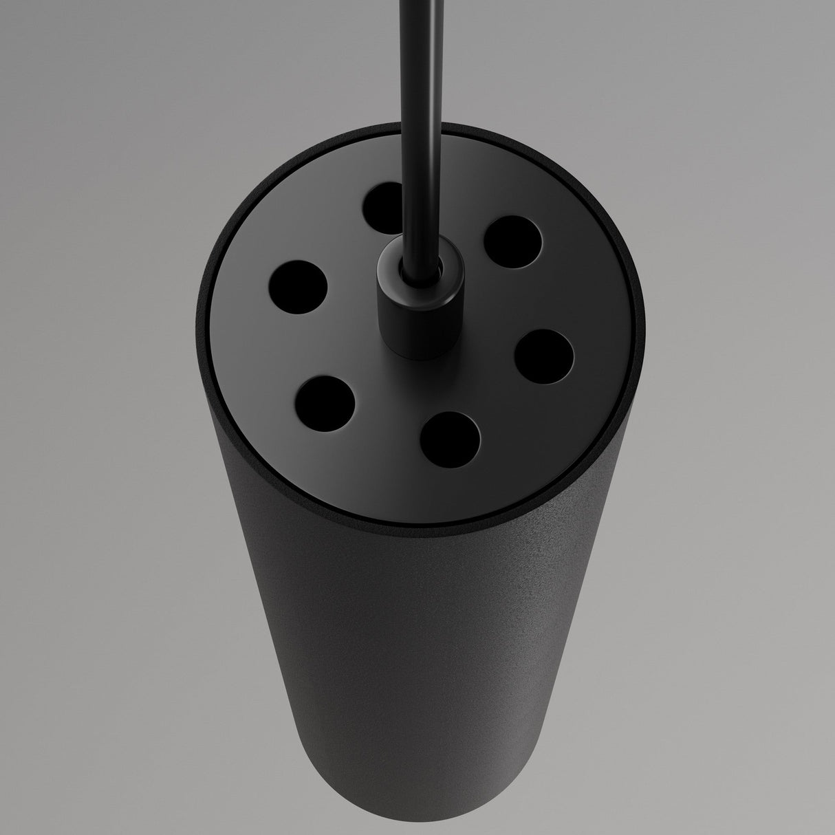 The Focus LED CCT Smart Dimmable Exility Magnetic Track Pendant Light 12W in Black features a cylindrical design with six round holes on top. A black rod extends from the center, set against a neutral gray background, enhancing its modern dimmable lighting options from 2700-6000K.