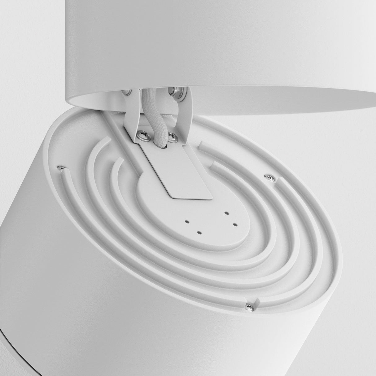 Close-up of the Yin LED Dimmable Single Phase Unity Track Spotlight, 15W, 4000K in white. It features a sleek circular design with a two-arm hinge mechanism connecting two cylinders and is set against a white background.