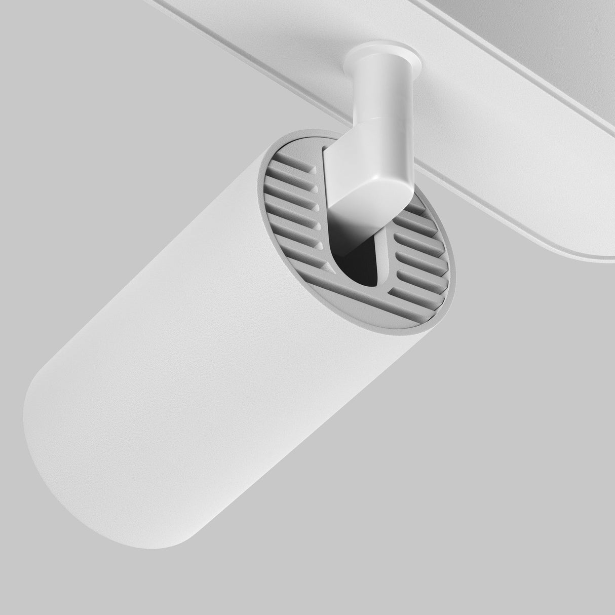 The Focus LED Magnetic Radity Track Spotlight 5W 3000K - White is a sleek, modern cylindrical ceiling-mounted fixture with a vented section near the top for cooling, attached to a horizontal bar on a light gray background, ideal for accent lighting in contemporary spaces.