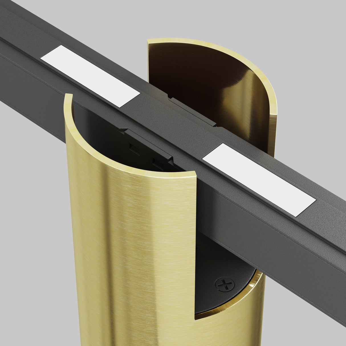 The Alfa CCT LED Dimmable Magnetic Exility Track Downlight 7W 2700-6000K in Brass features a modern metallic clamp securing a sleek black beam with white pads. The brass finish and semi-circular holder create an elegant setup, epitomizing sleek lighting design against a gray background.