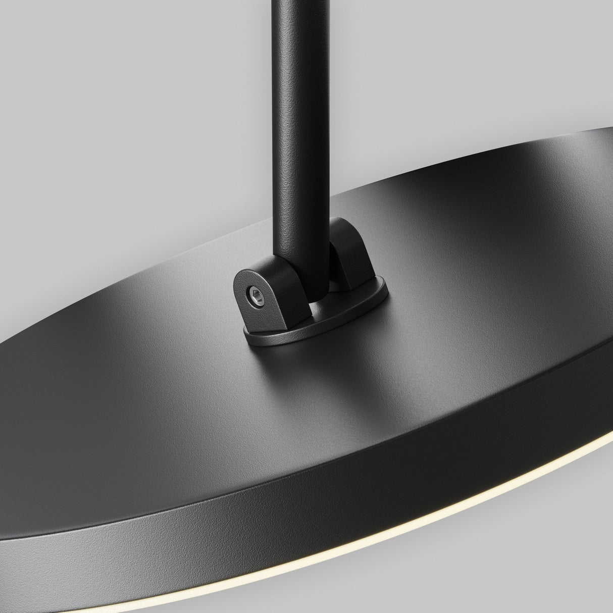 Close-up of the Plato CCT LED Dimmable Magnetic Exility Track Spotlight in black, featuring a sleek design with a cylindrical base and circular dimmable spotlight. The matte finish contrasts with its adjustable 2700-6000K light, providing a personalized ambiance against a neutral gray background.
