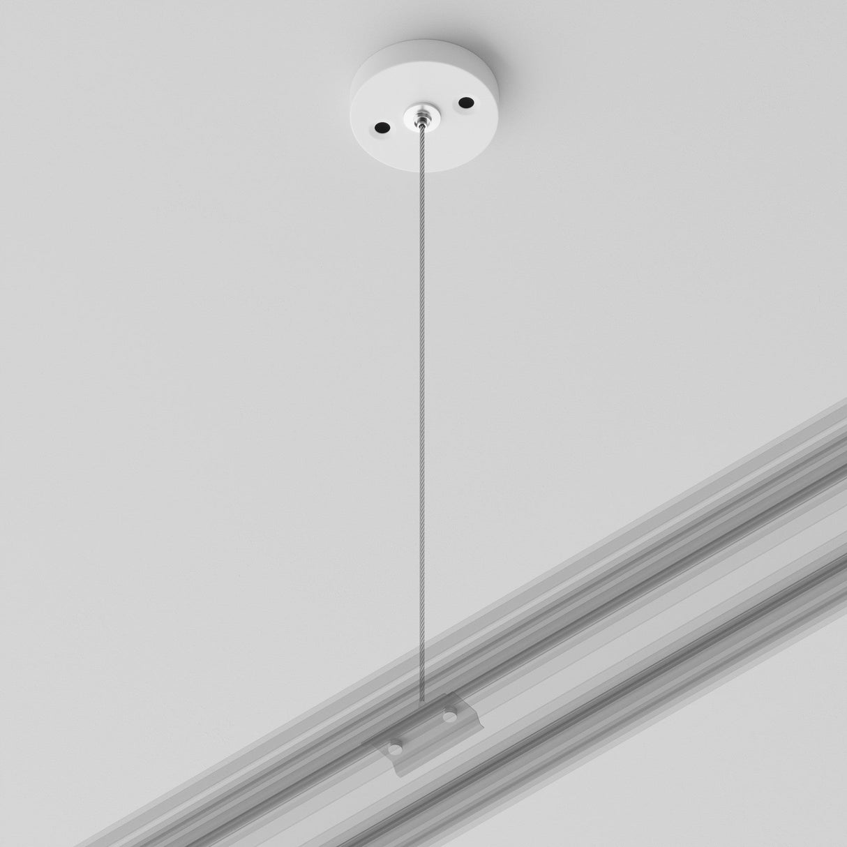 The Unity Single Phase Surface-Mounted Track Suspension Cable in white features a round base, thin metal cable, and silver connector on a linear track, offering a minimalistic setup against a plain white ceiling for single-phase lighting.